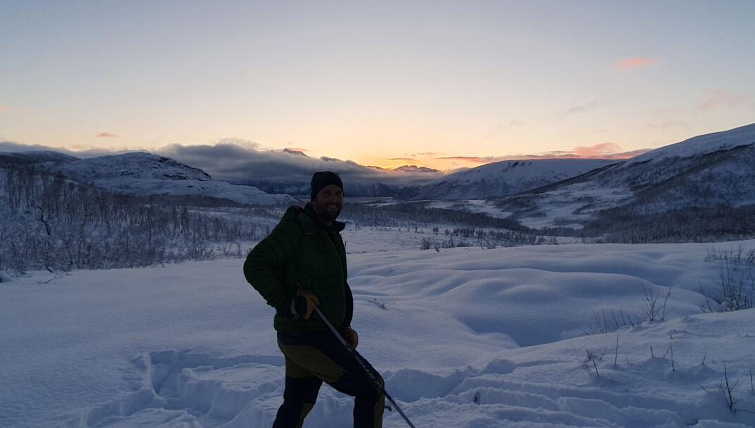 A guest looks out from the mountains as the sun goes down