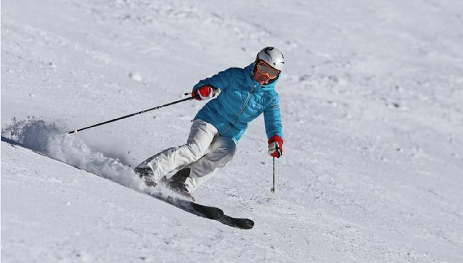Alpinist with blue jacket