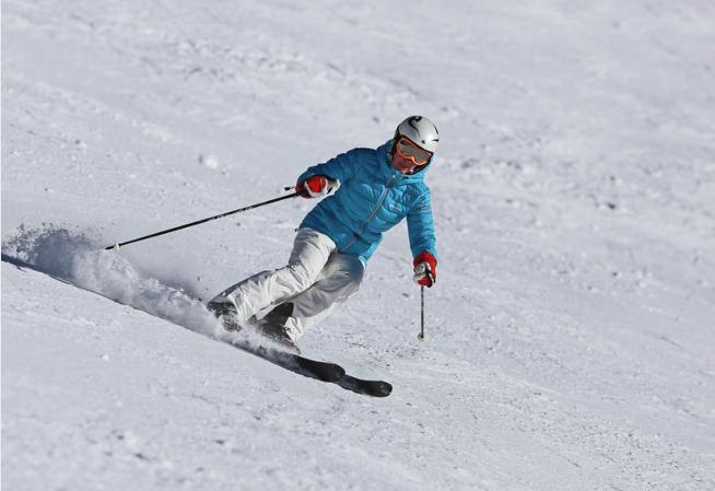Alpinist with blue jacket