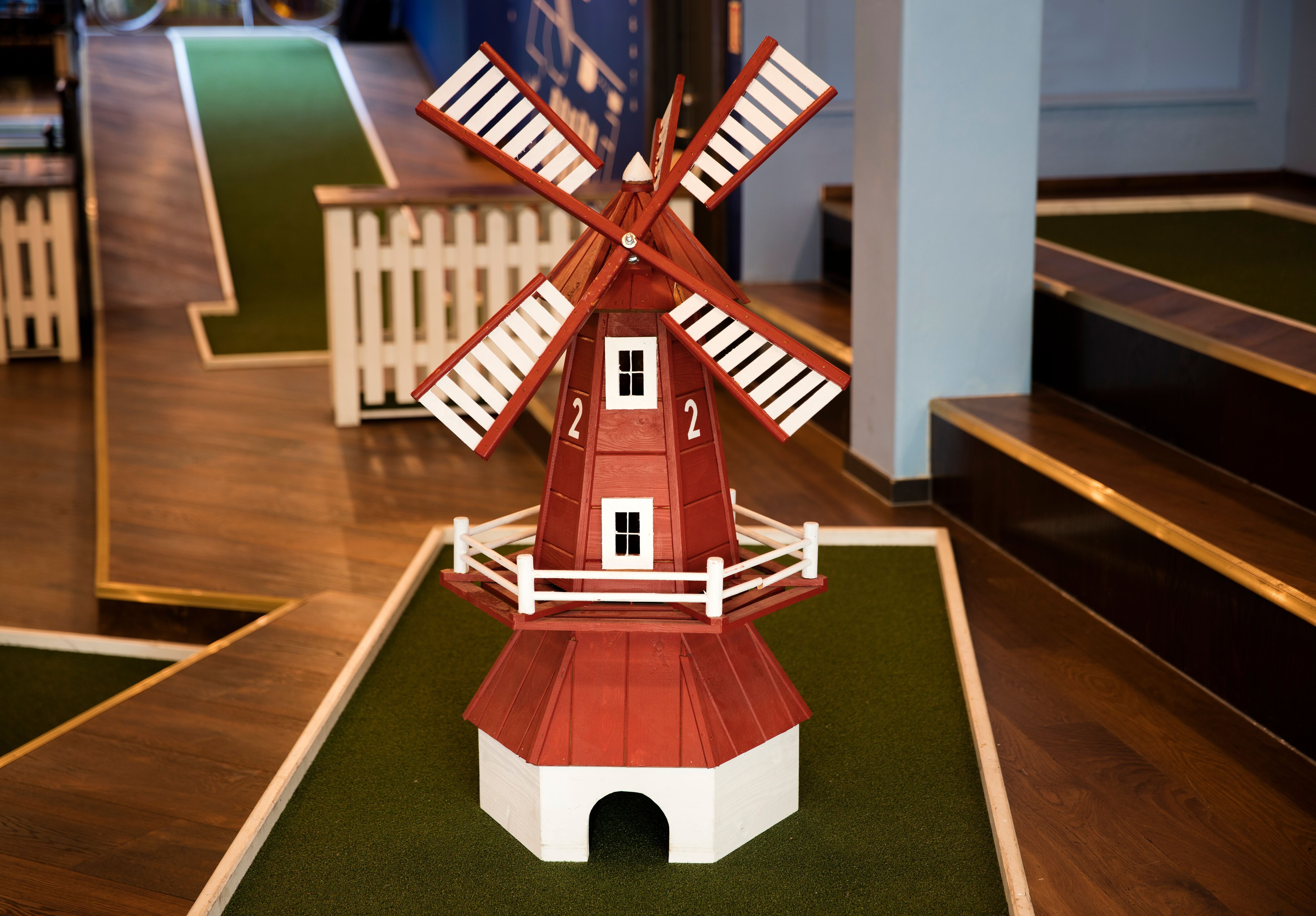 hole in the miniature golf course with a miniature windmill on