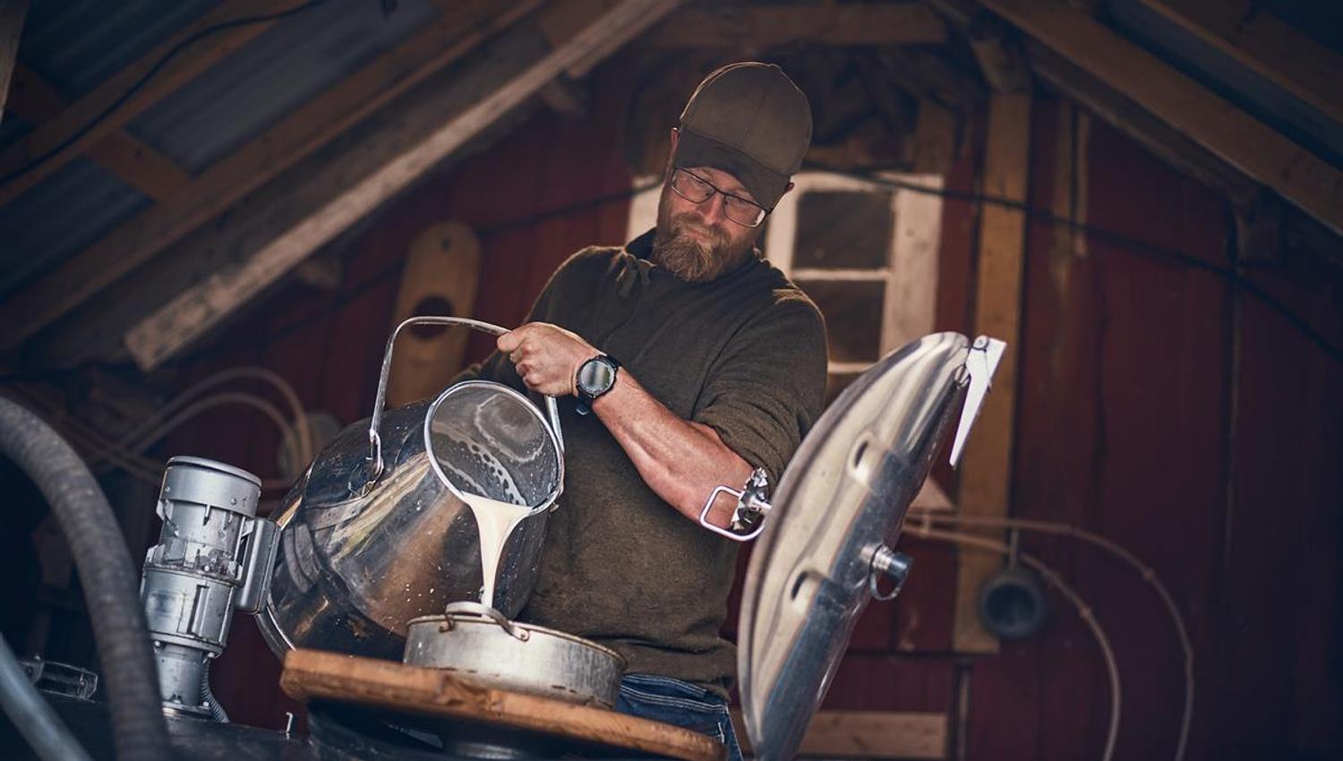 Man pouring milk.