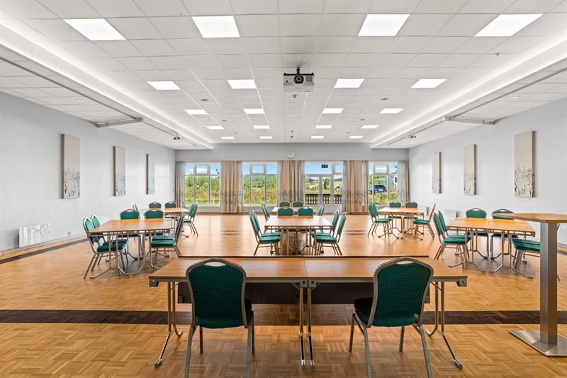 conferense room with table and chairs  with view through windows