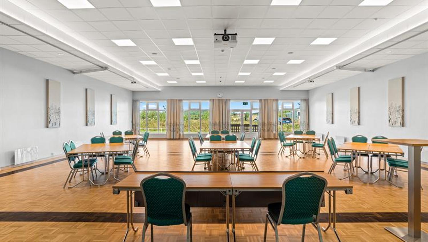 conferense room with table and chairs with view through windows
