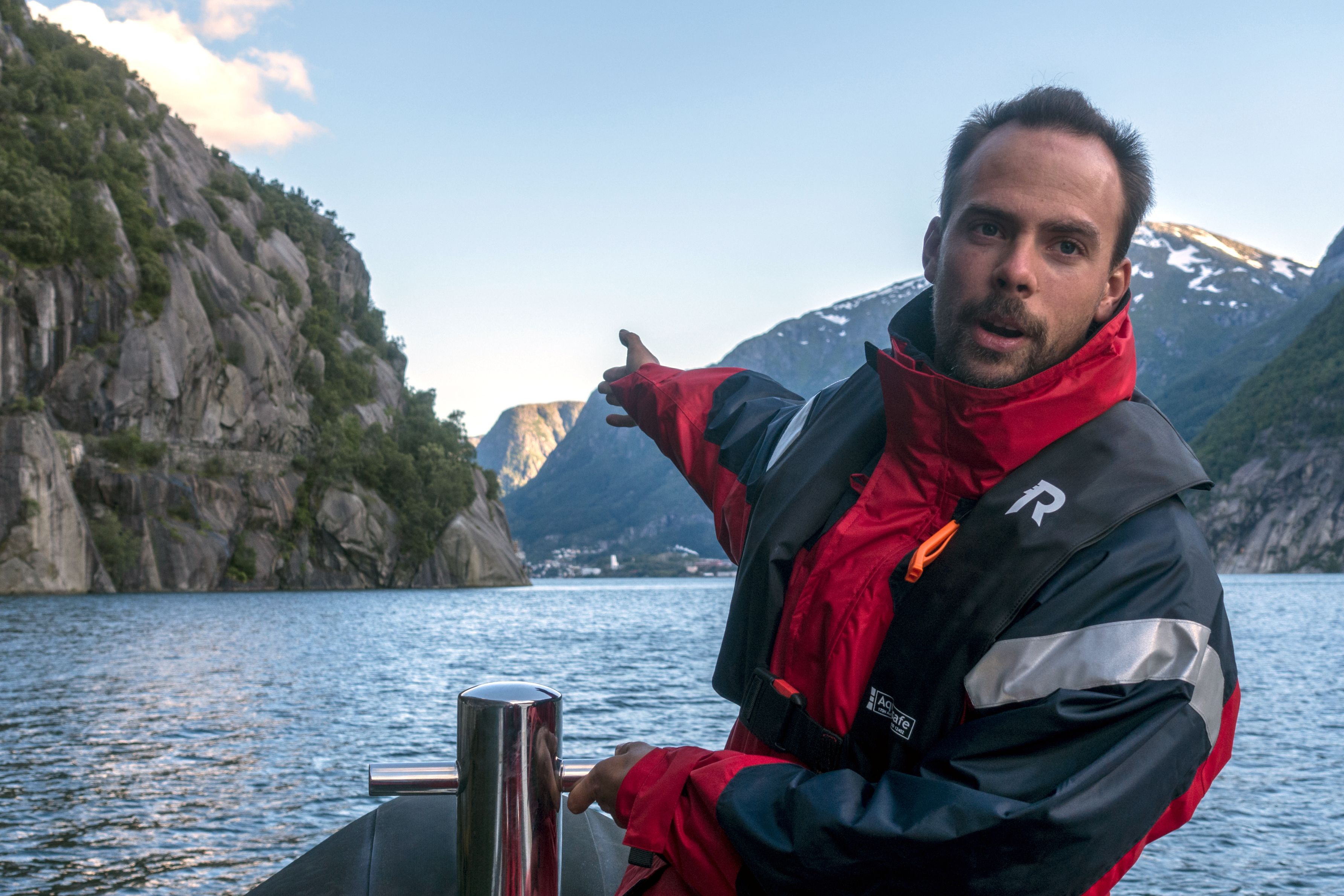 A local guide points out scenic attractions during the RIB safari in Hardanger.