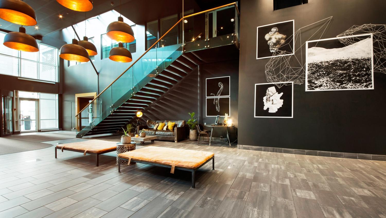 Lobby and entrance. Black-and-white art on the walls. Photo.