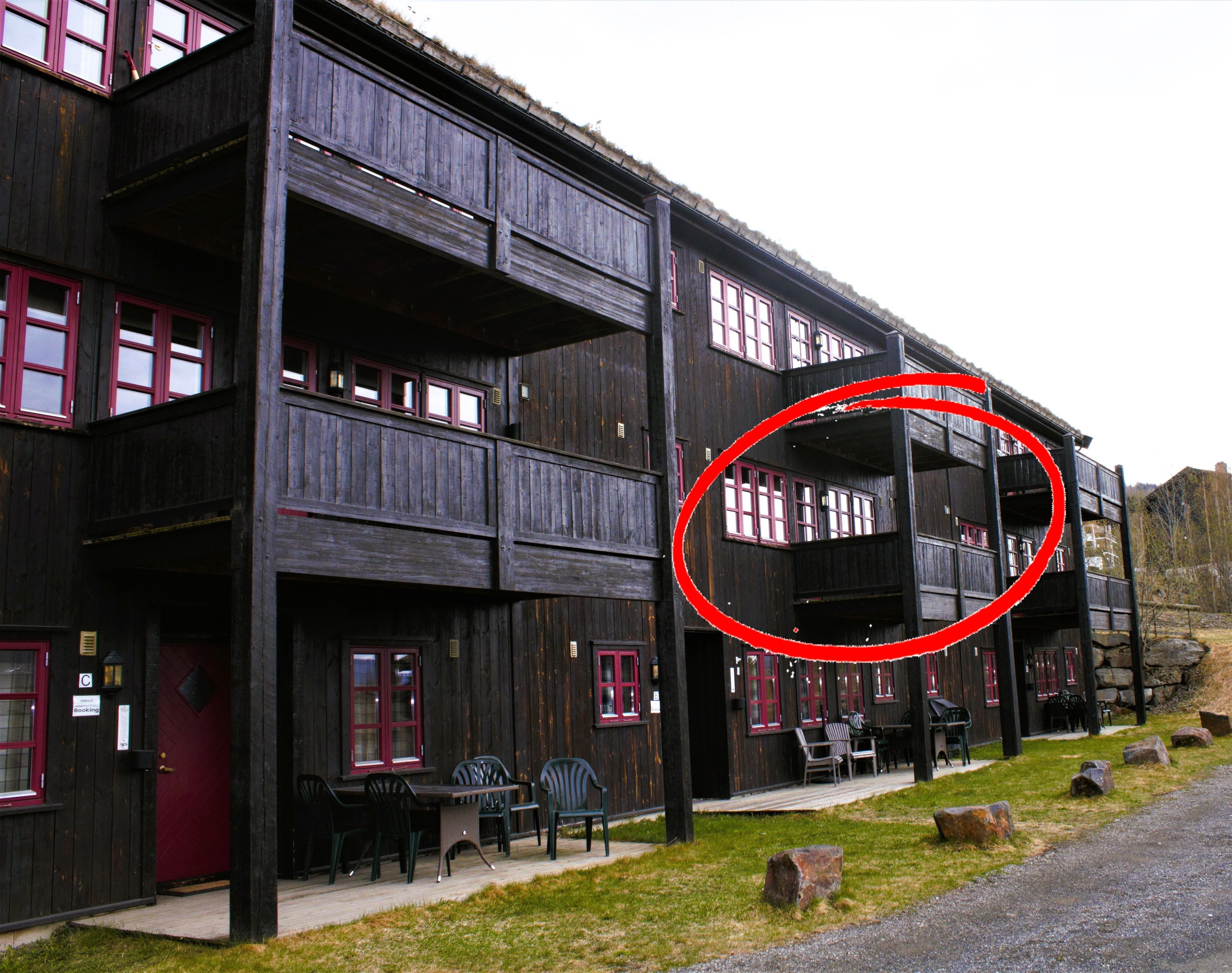 A building with a red circle.