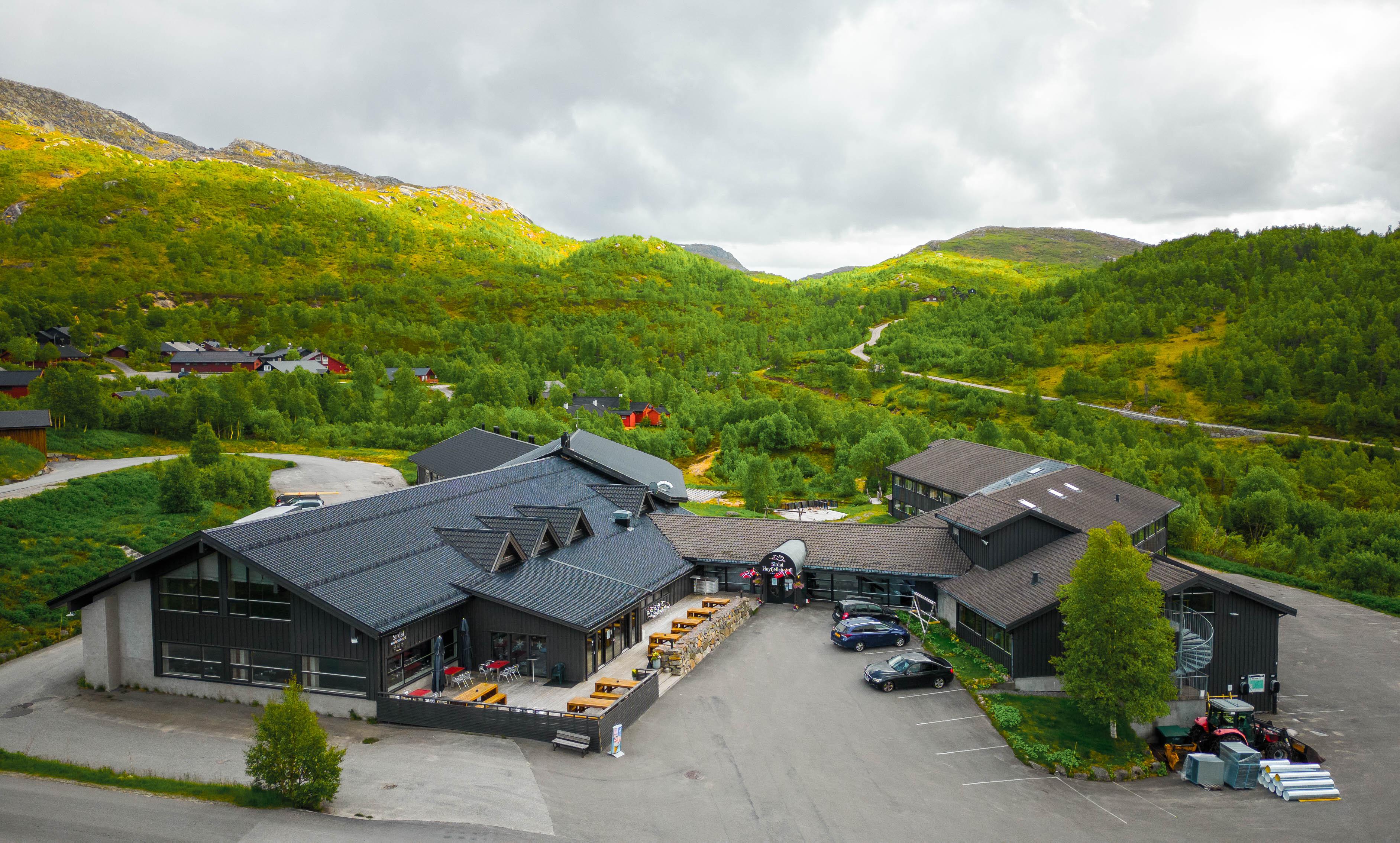 During the summer, the landscape in the mountains is green and lush.