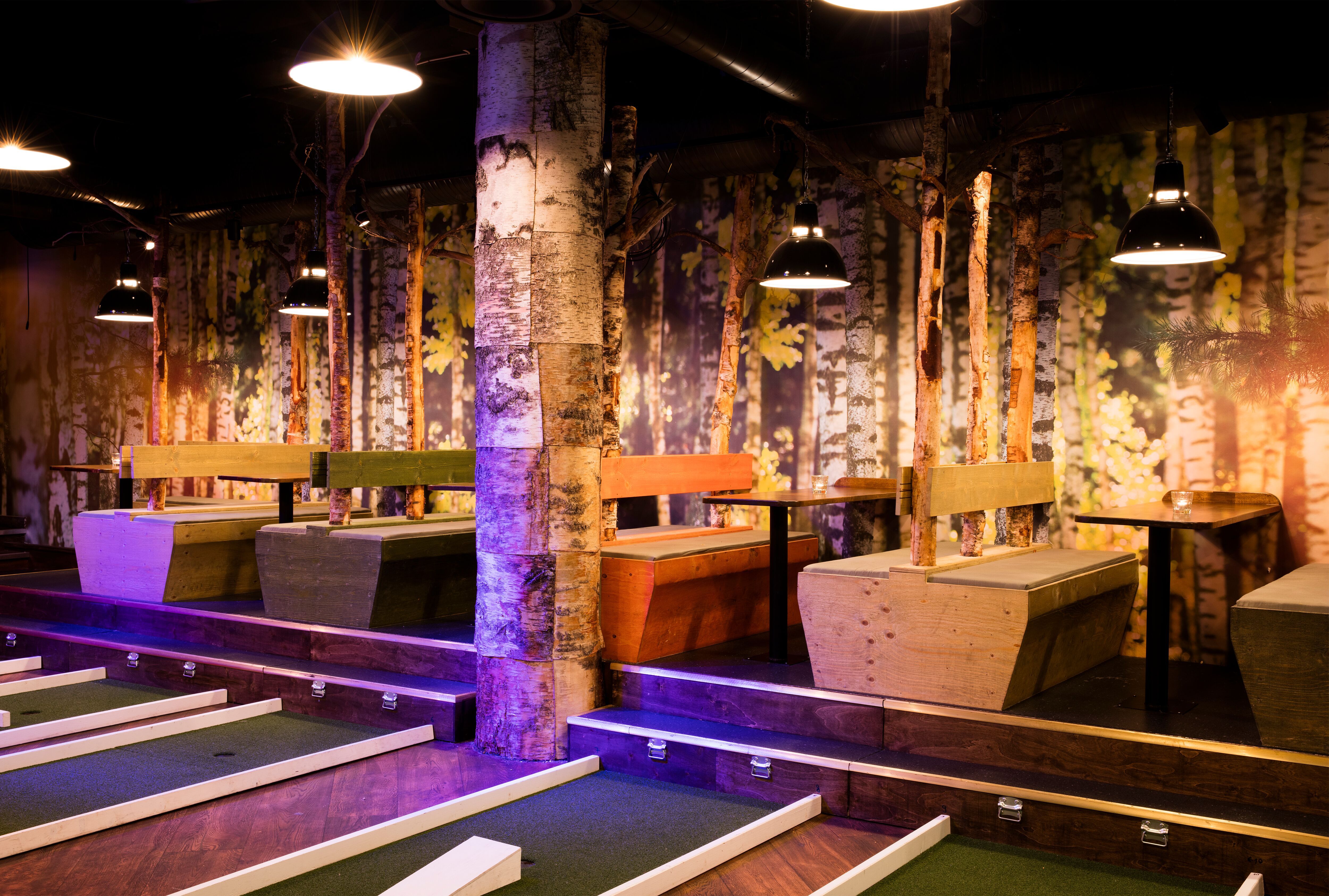 seating area: made of wood with tree trunks and wallpaper with trees as decoration