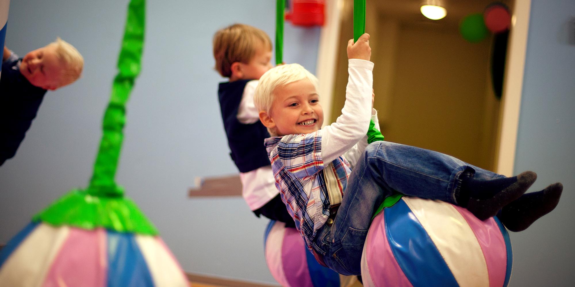 Lykkeland, a play centre in Steinkjer - girl on a hanging ball