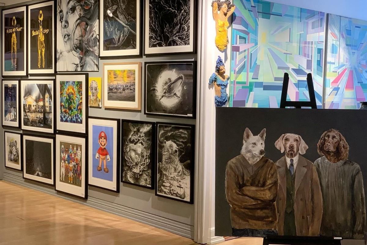 Close up picture of art, one showing dogs in human clothes, and one abstract