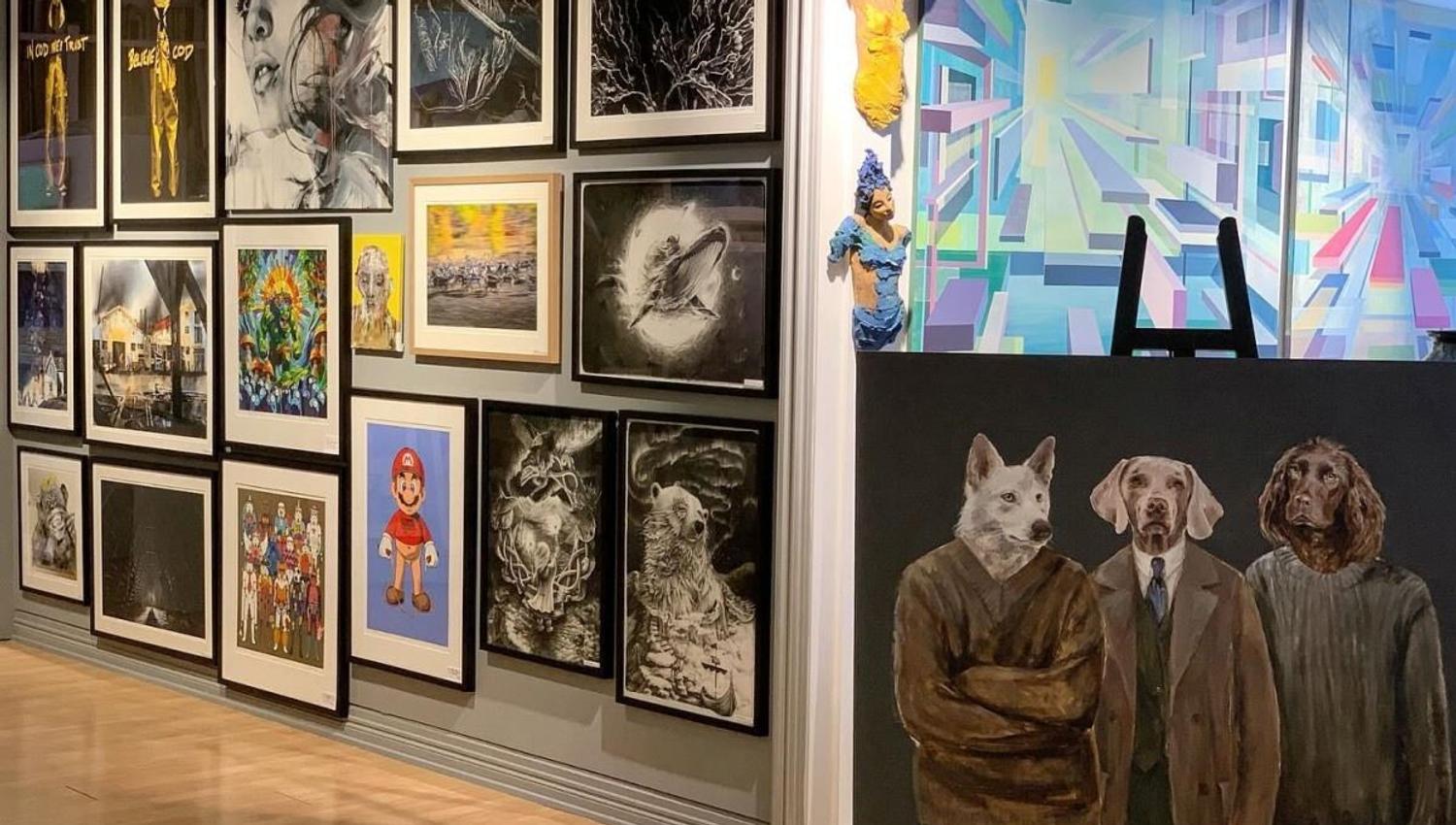Close up picture of art, one showing dogs in human clothes, and one abstract