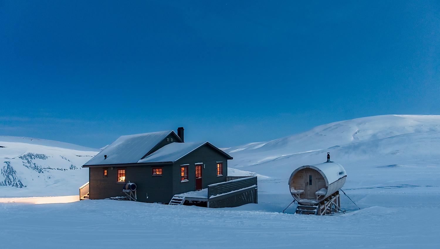 Juva Cabin underneath a blue sky