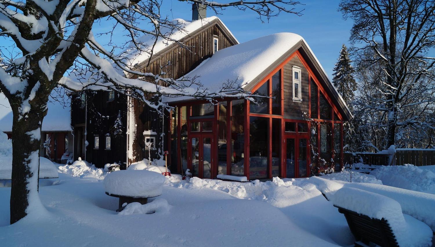 Farmhouse in winter. snow and houses.