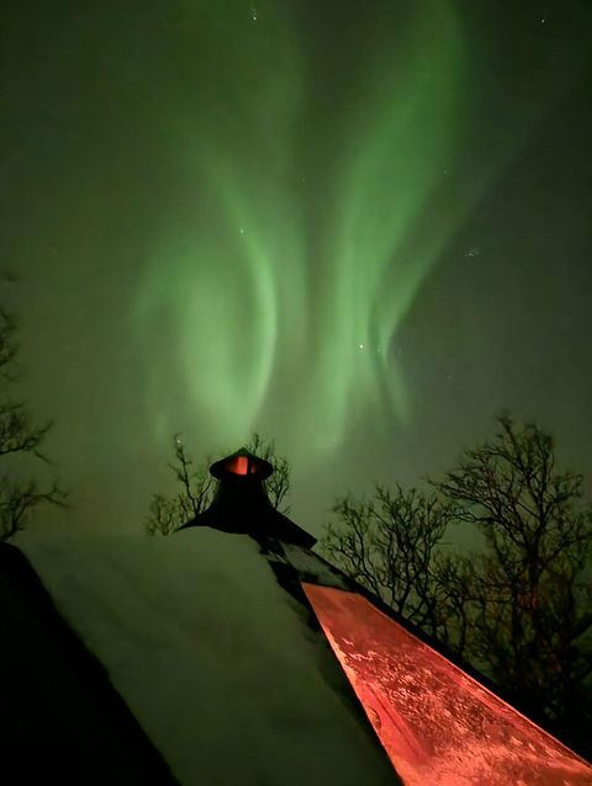 Northern lights and cabin