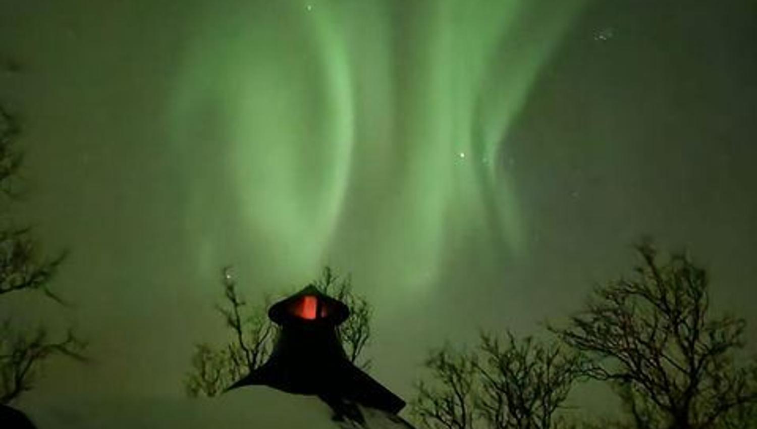 Northern lights and cabin