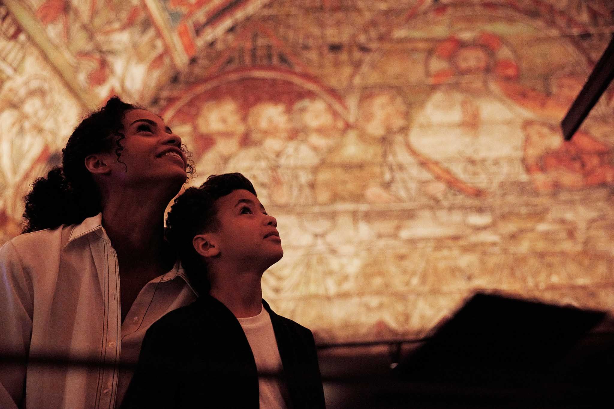 Woman and child looking at the roof from Ål stave church