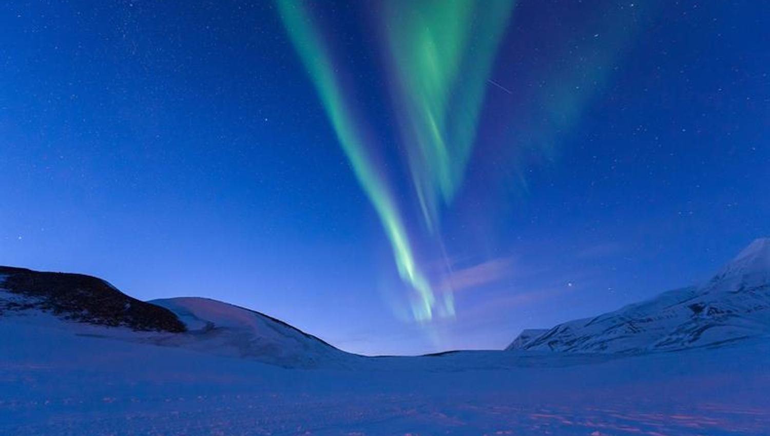 The northern lights are dancing on the sky.