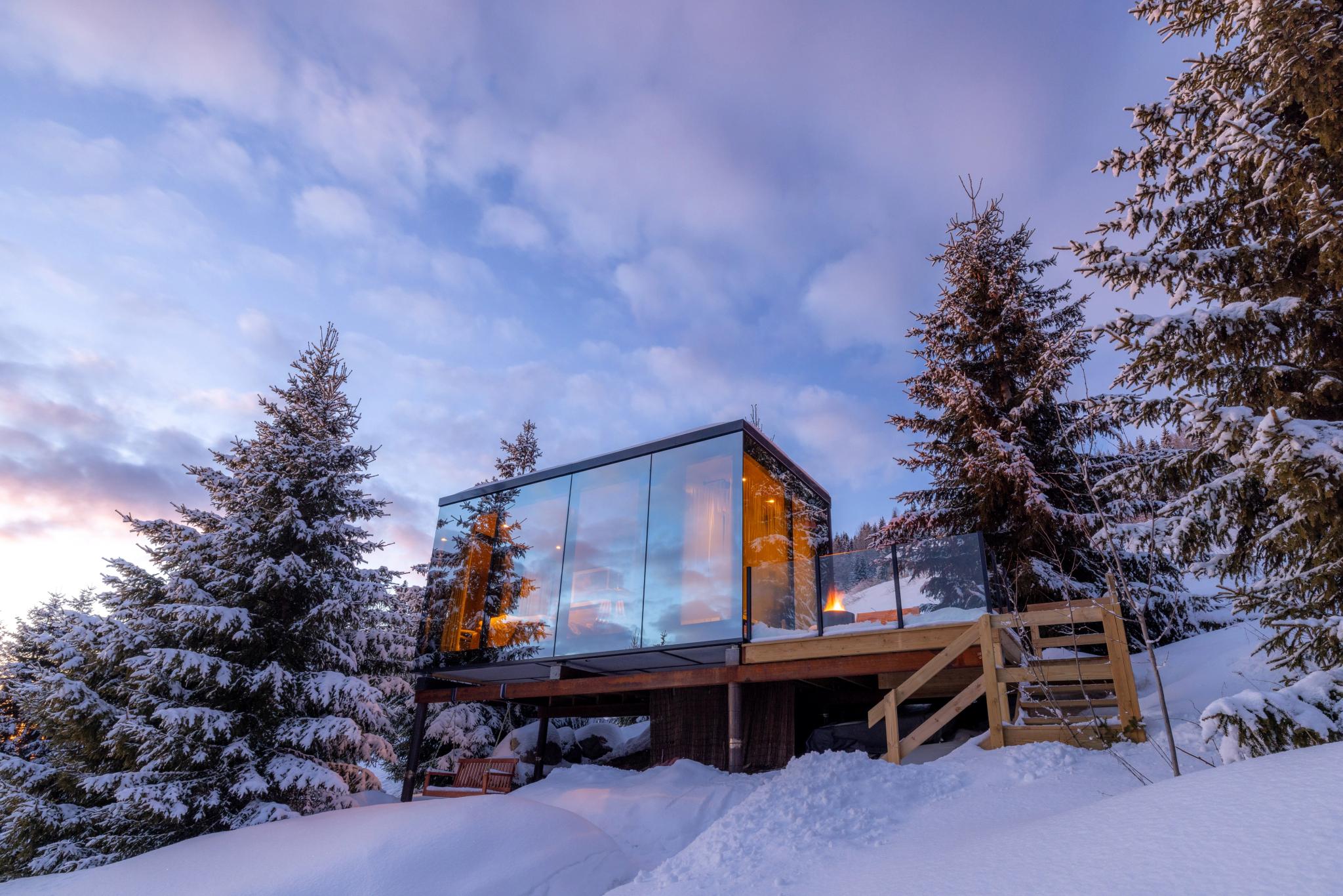 View of the mirror cabin during winter