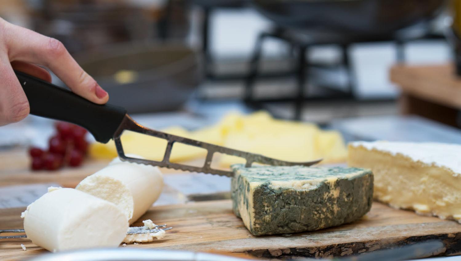 Cheese buffet and cheese knife Thon Hotel Terminus in Oslo. Photo.