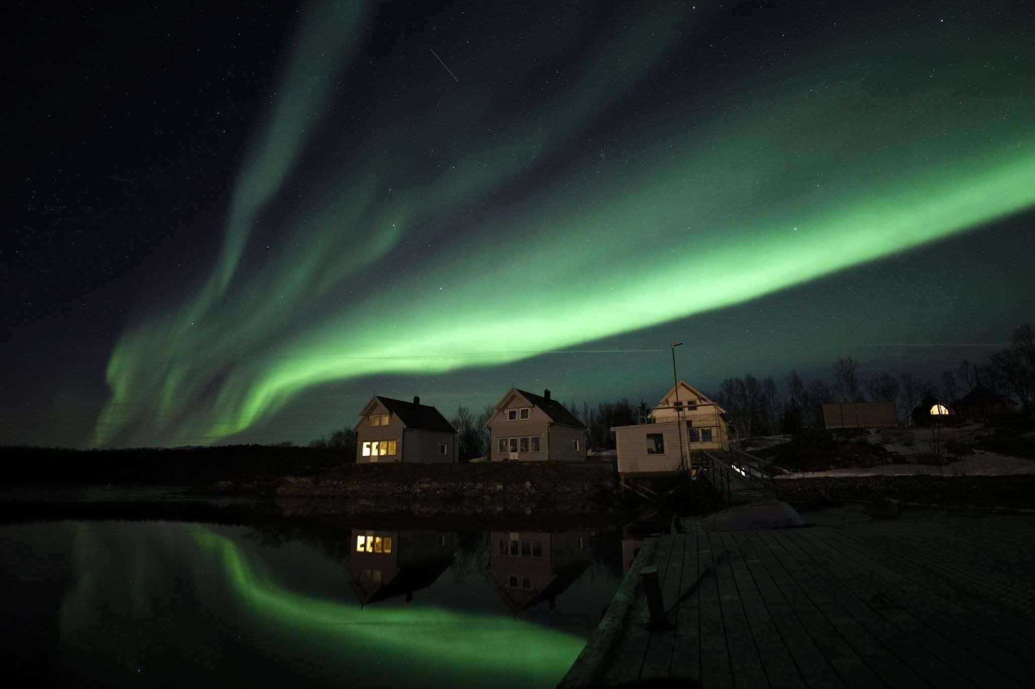 beautiful northern lights over local houses