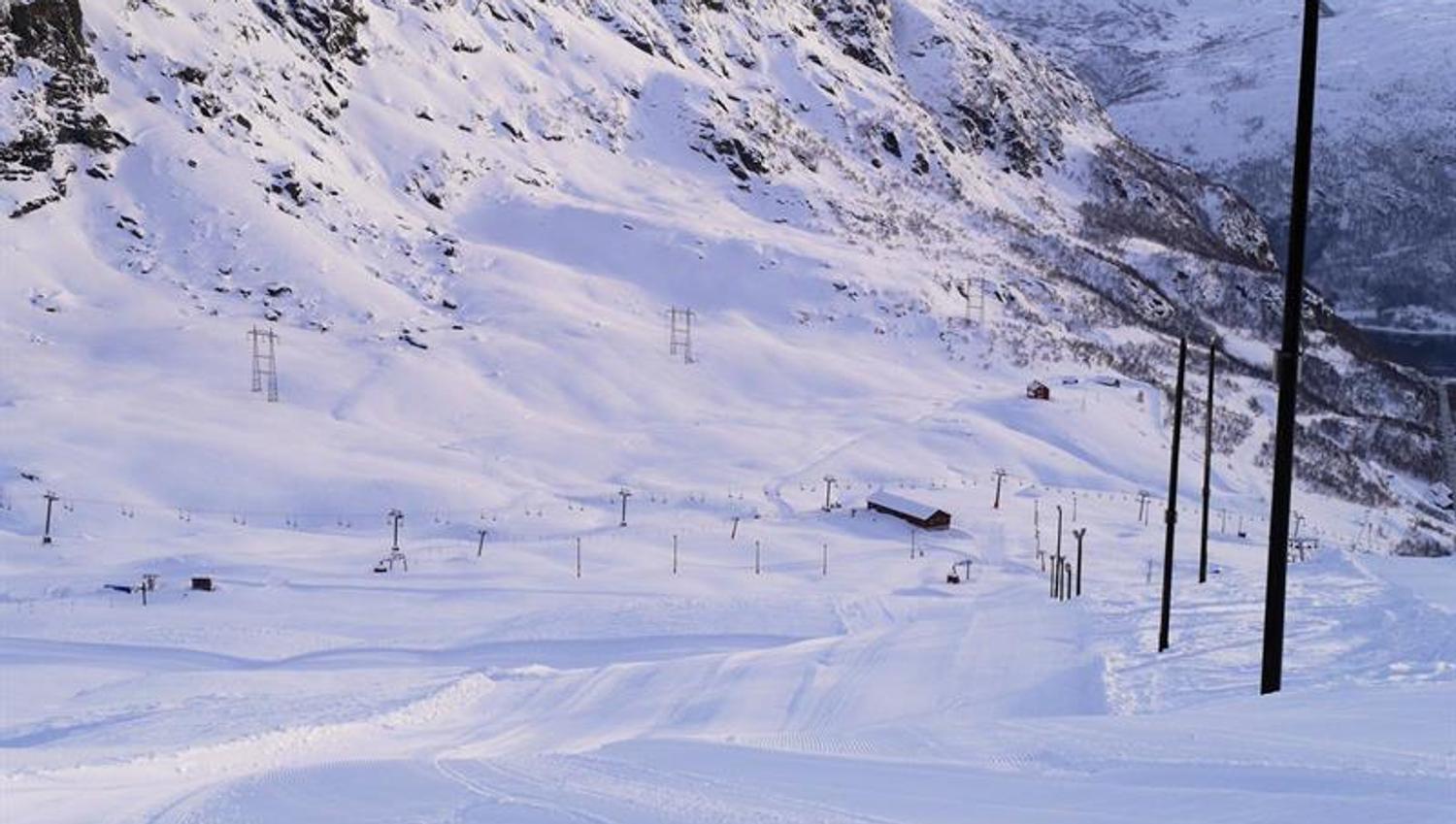 Freshly groomed slopes at Røldal Ski Resort surrounded by steep mountain scenery.