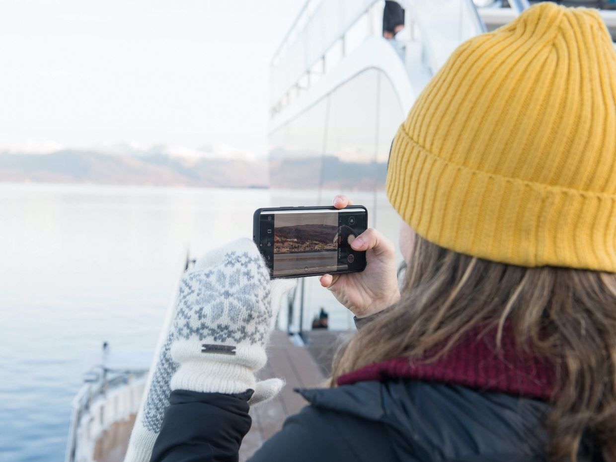 Girl photographing from Brim Explorer