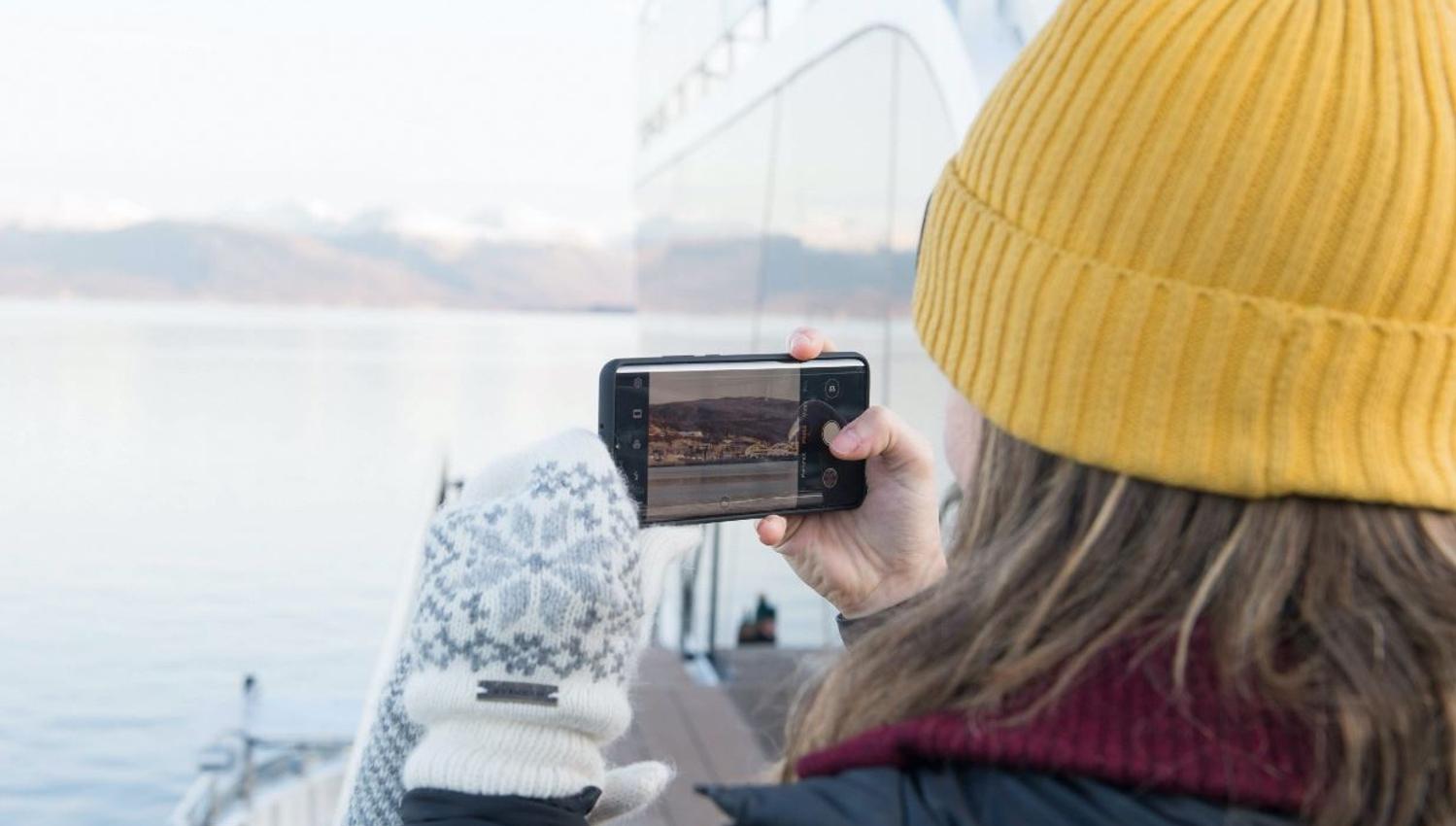 Girl photographing from Brim Explorer