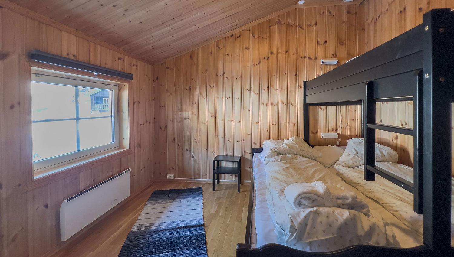 A room with a bed and a window.