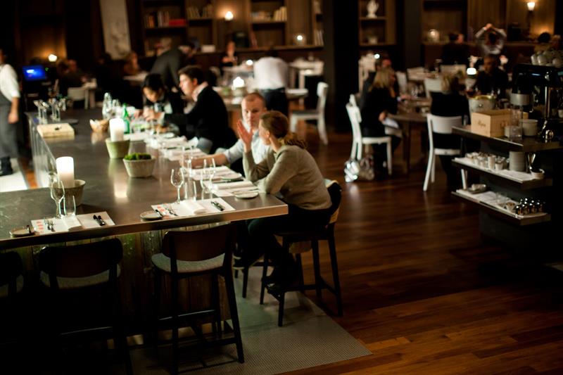 People sitting by the bar.