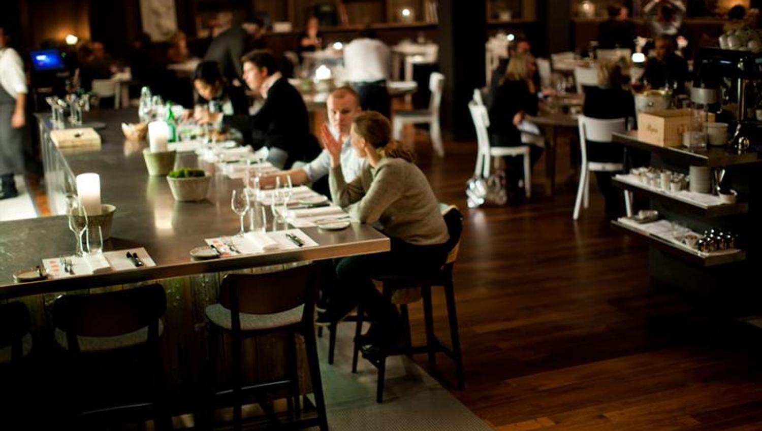 People sitting by the bar.