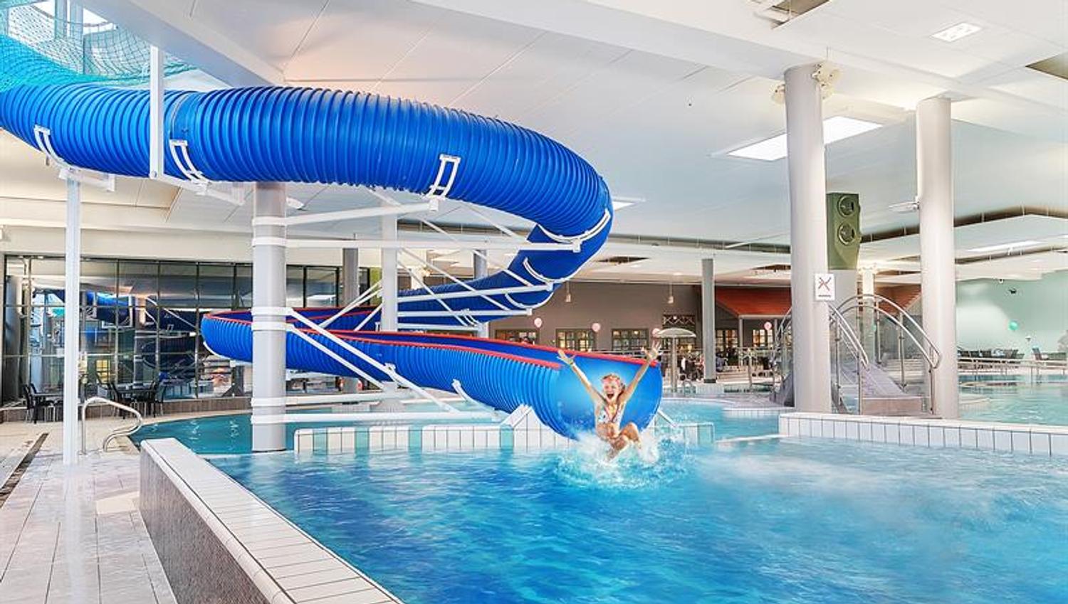 Girl sliding on the bathing slide in the water park at Quality Hotel Sarpsborg. Photo.