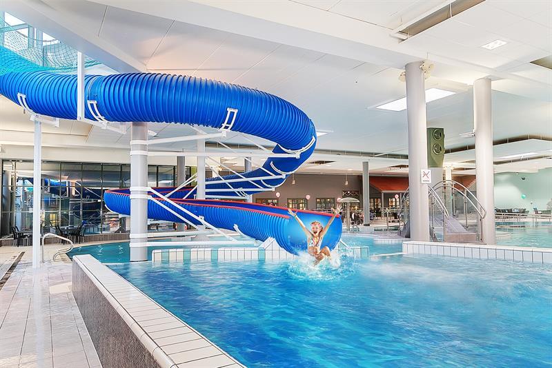 Girl sliding on the bathing slide in the water park at Quality Hotel Sarpsborg. Photo.
