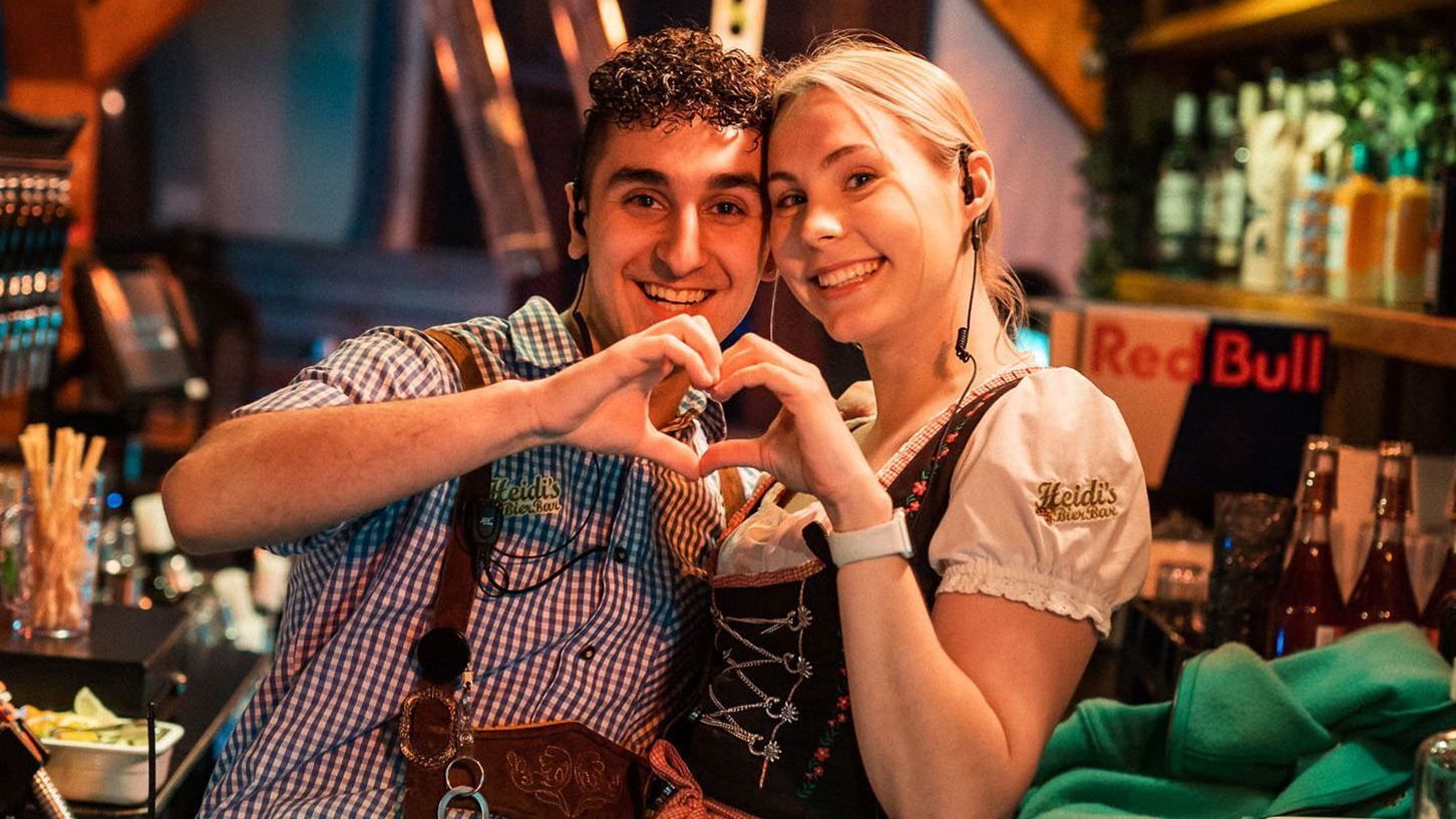 Employees making a heart with their hands