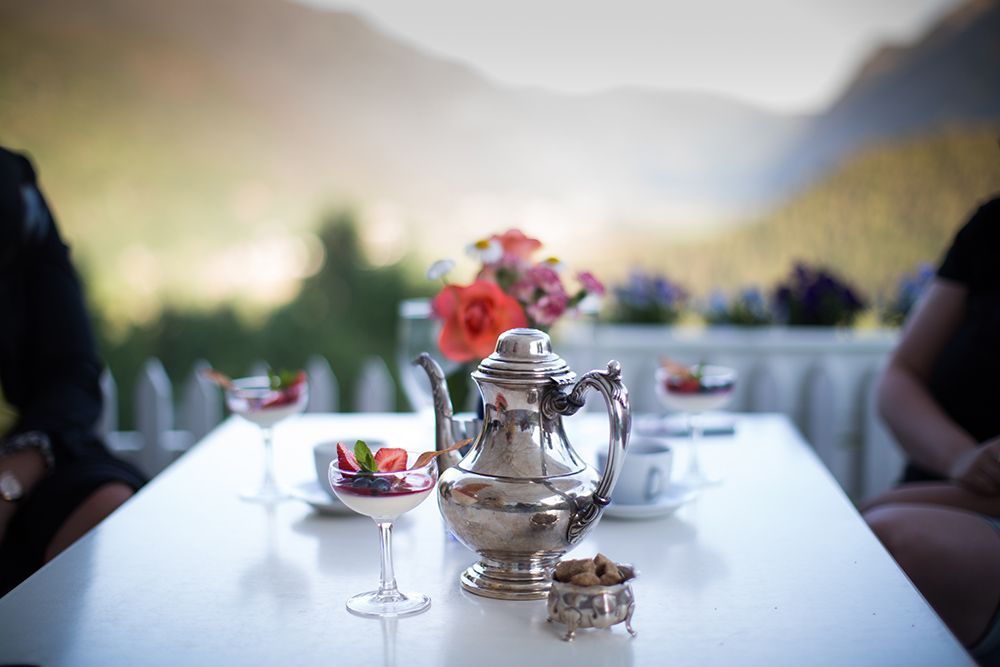 dessert and coffee on the terrace table in the restaurant at Nutheim Gjestgiveri 