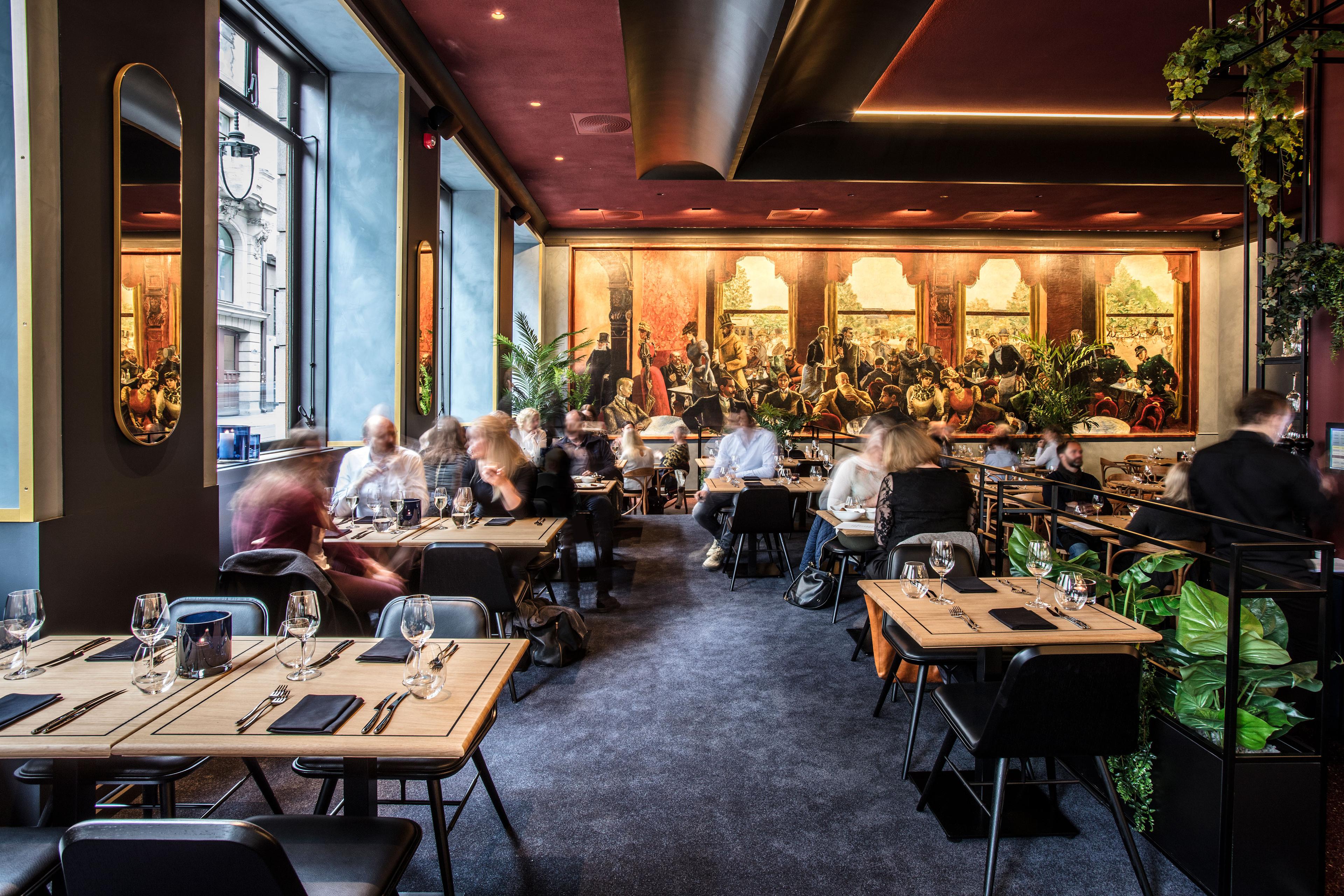 Interior of Grand Café woth people dining.