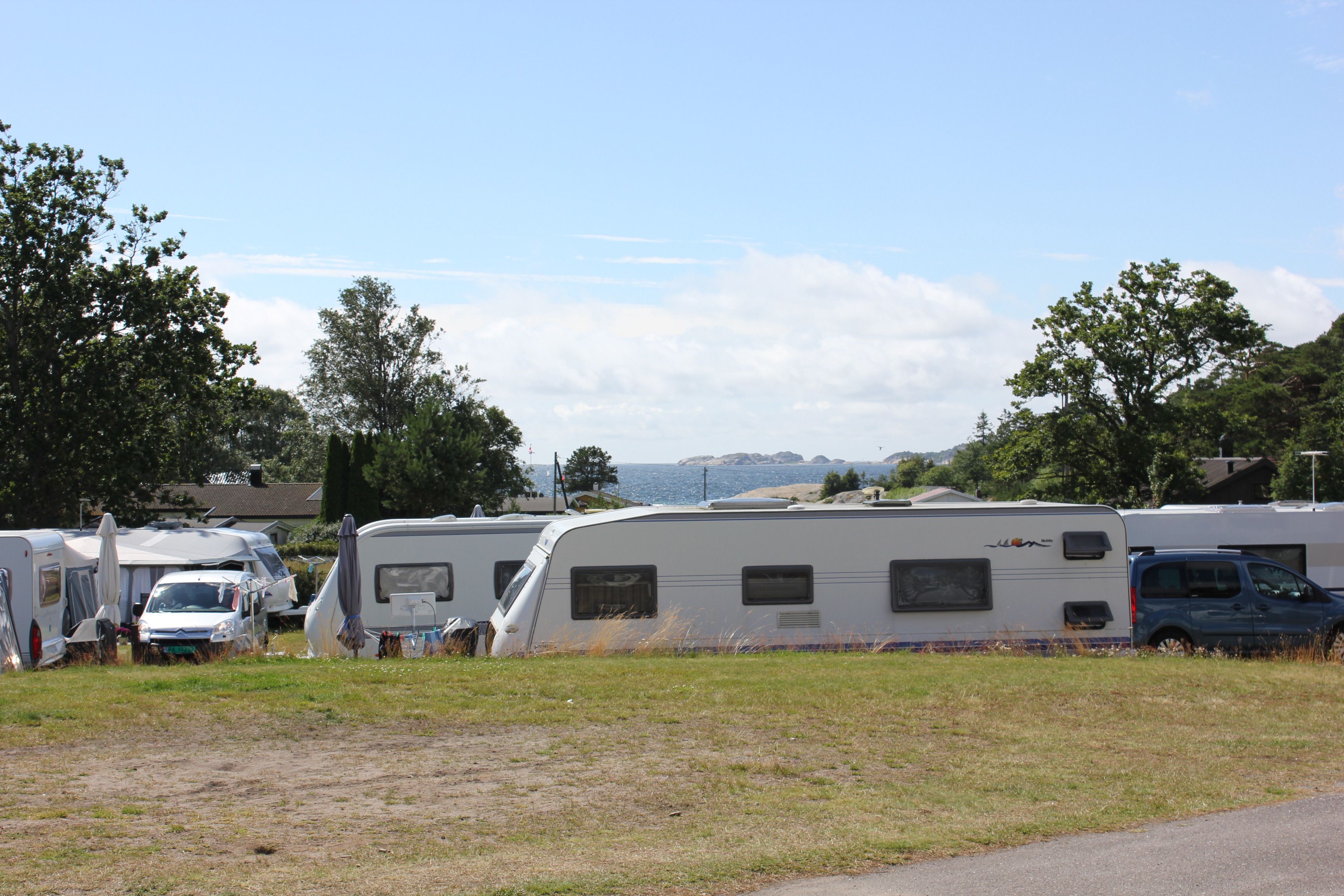 Caravans, sea in the background