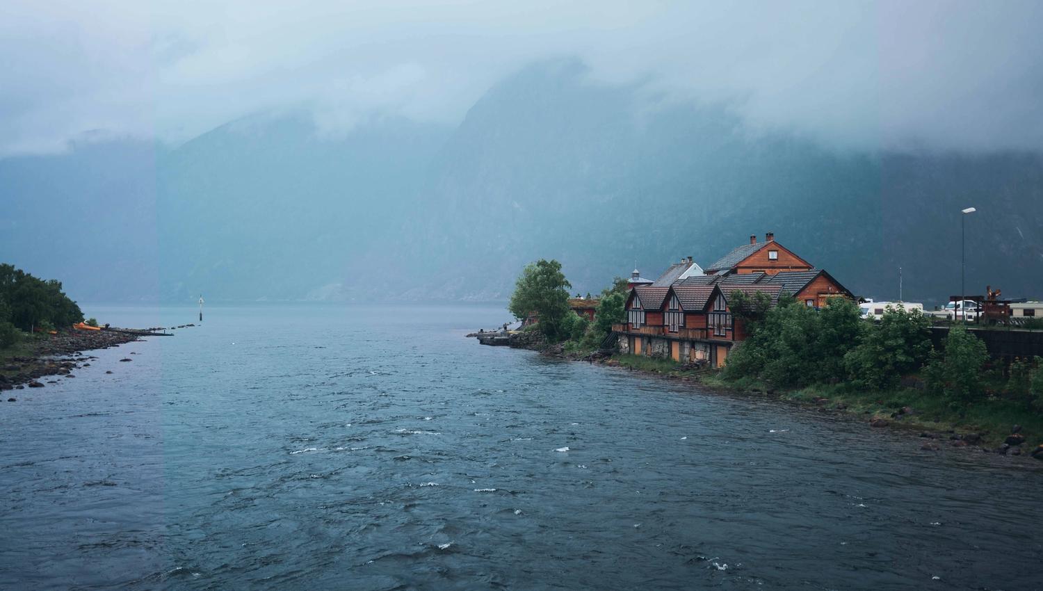 The Eio river with the riverside cabins in the background.