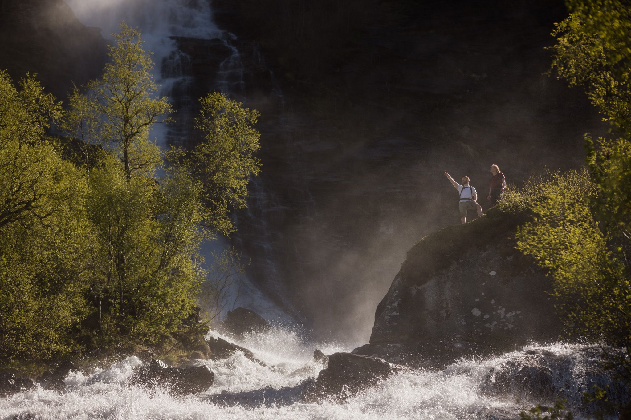 The trip ends below a mighty waterfall