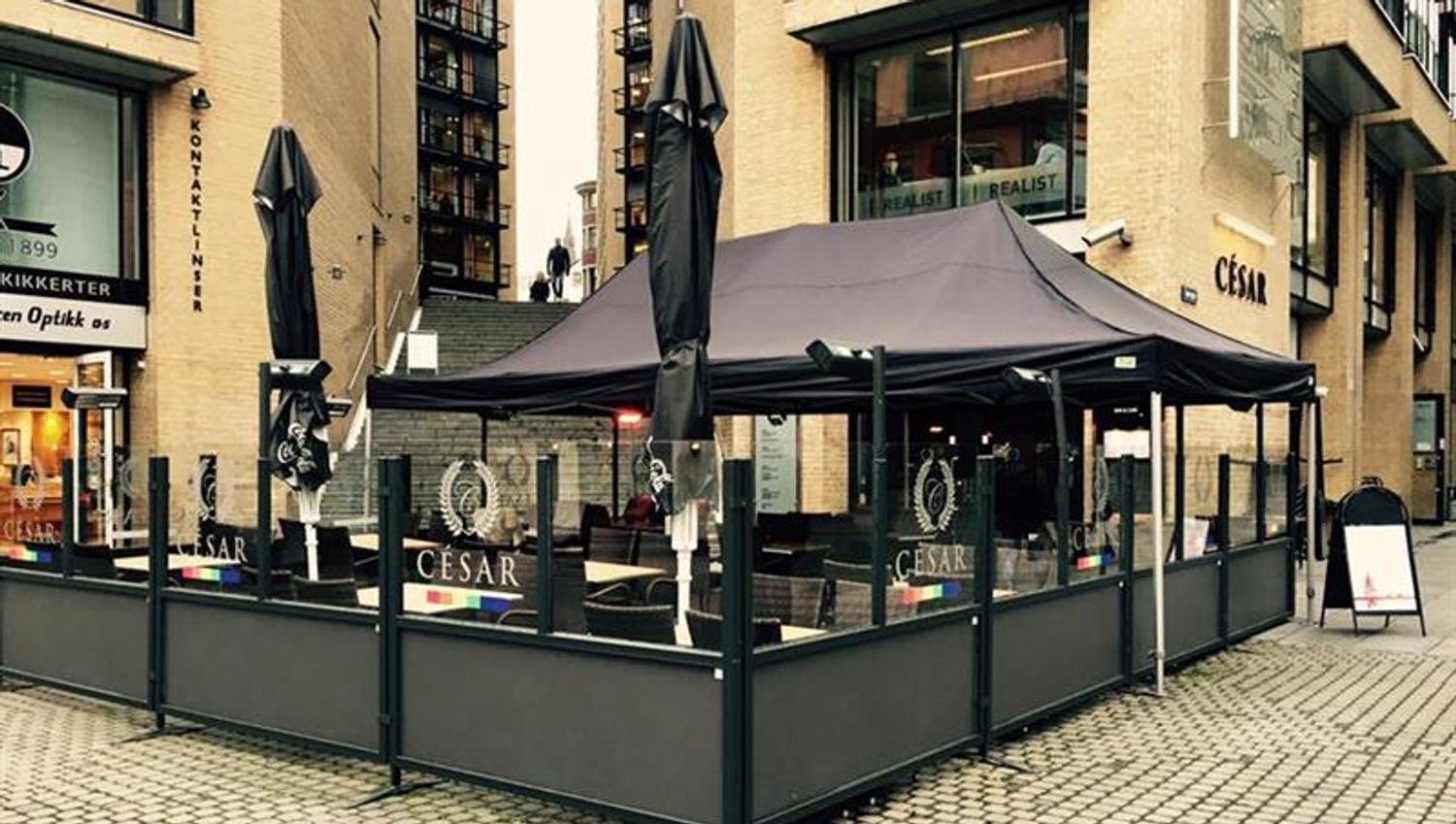 Exterior with a large outdoor terrace and parasols.
