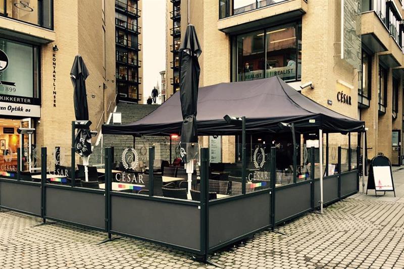 Exterior with a large outdoor terrace and parasols.