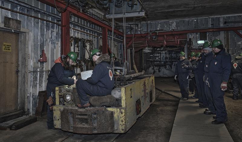 Guests on a guided tour of Mine 3 being shown around the mechanical workshop in the mine