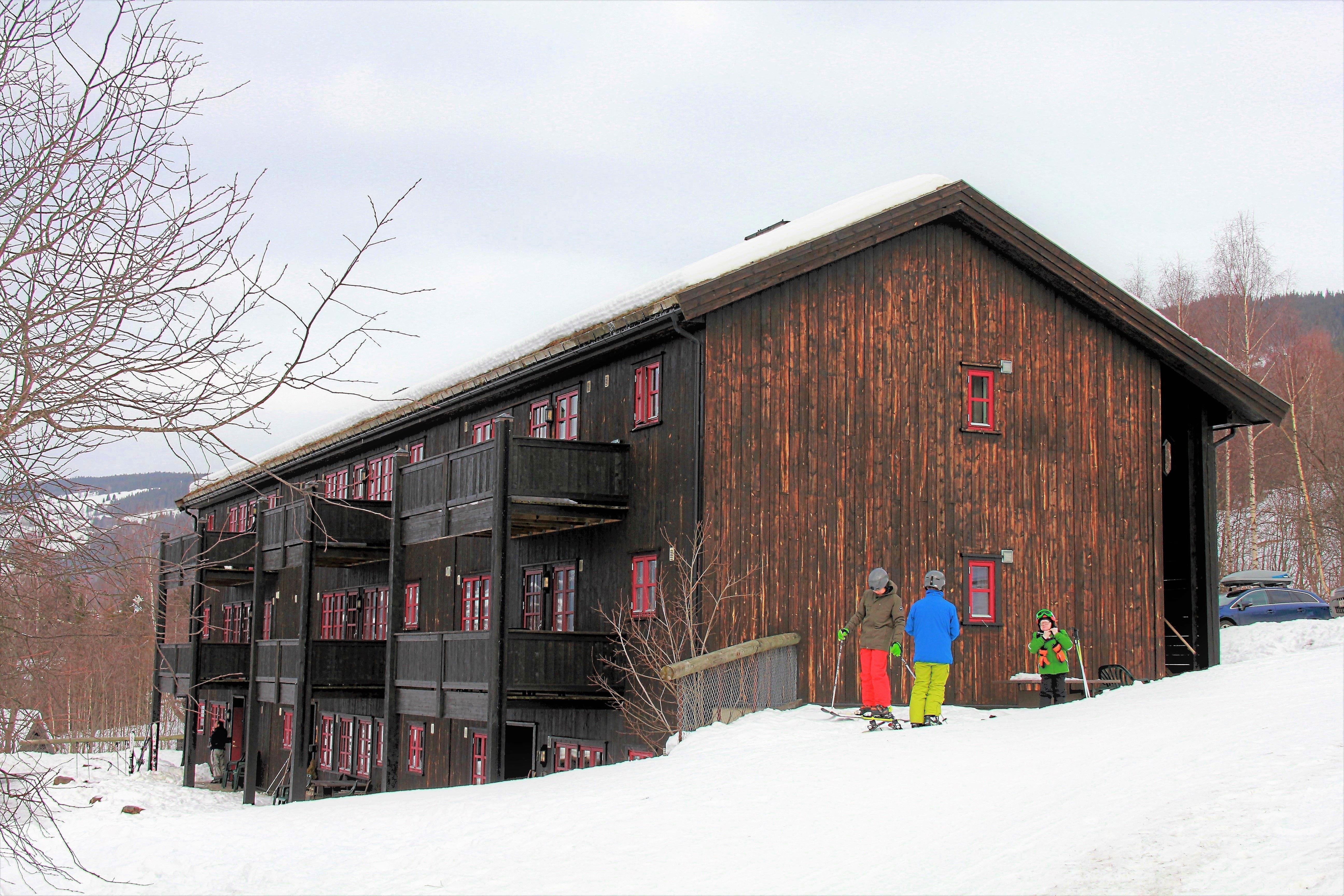 A group of people standing outside a building.