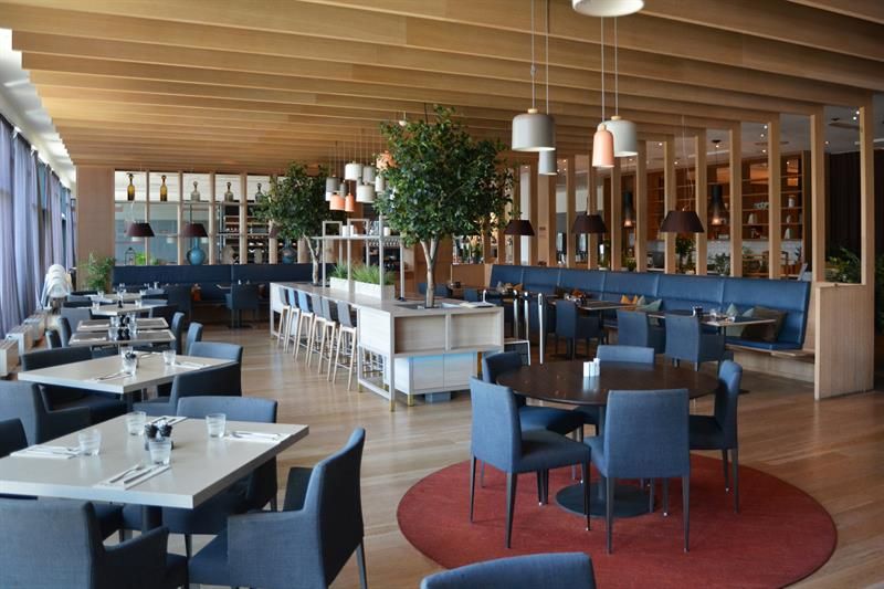 Tables in restaurant with blue chairs