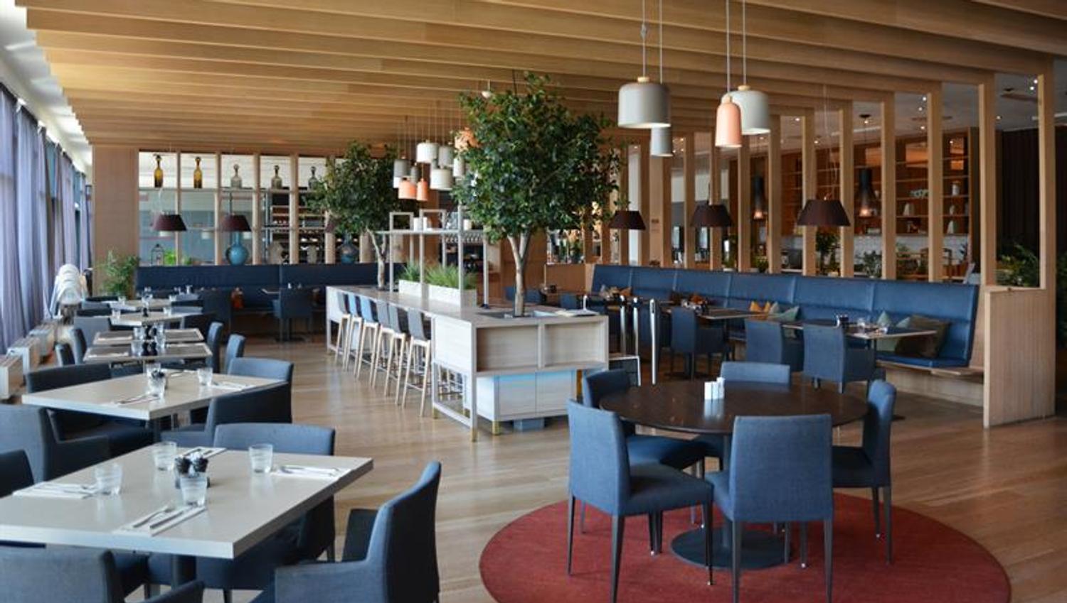 Tables in restaurant with blue chairs