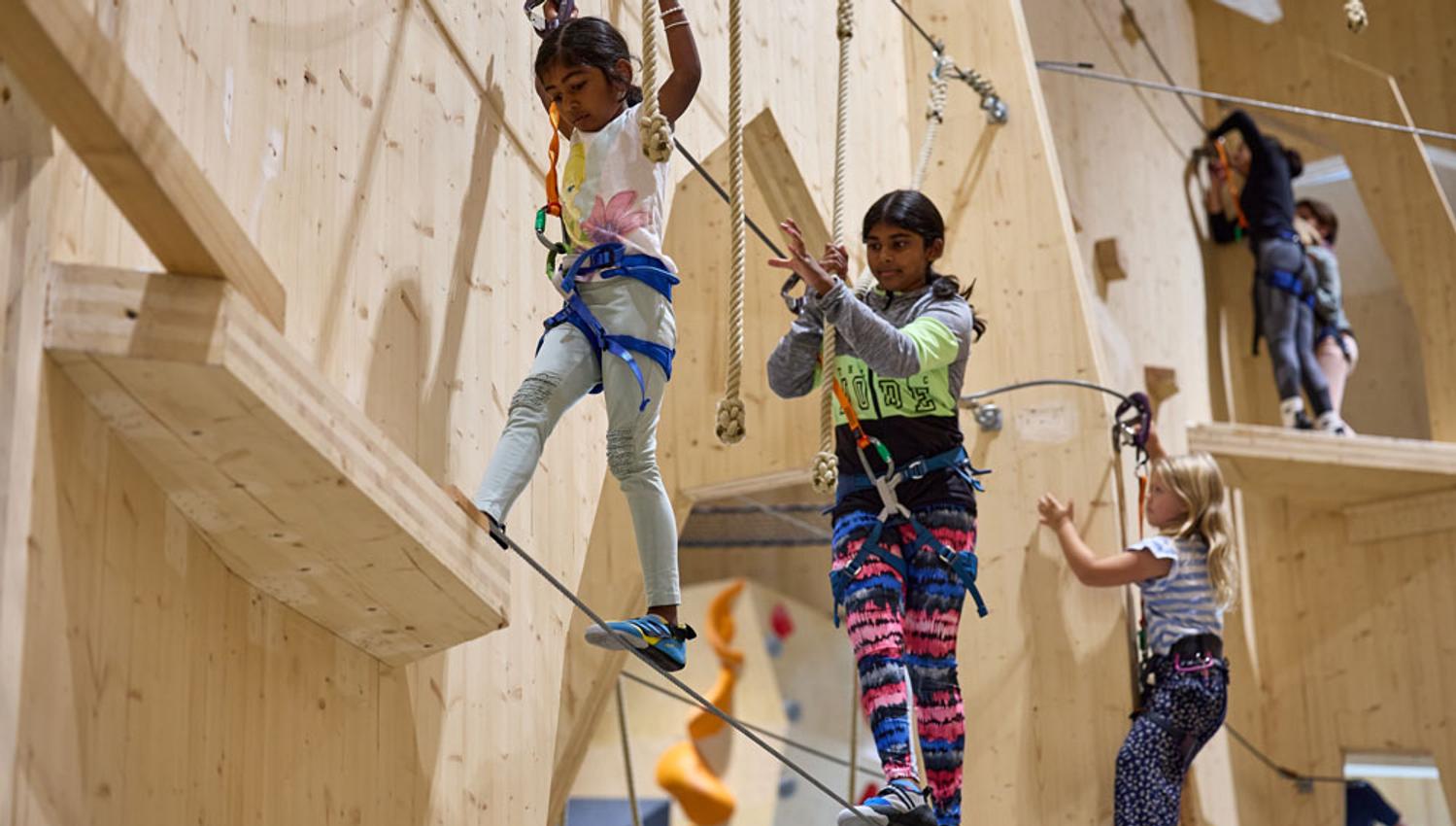 children climbing on "Høyt under Taket" in Skien