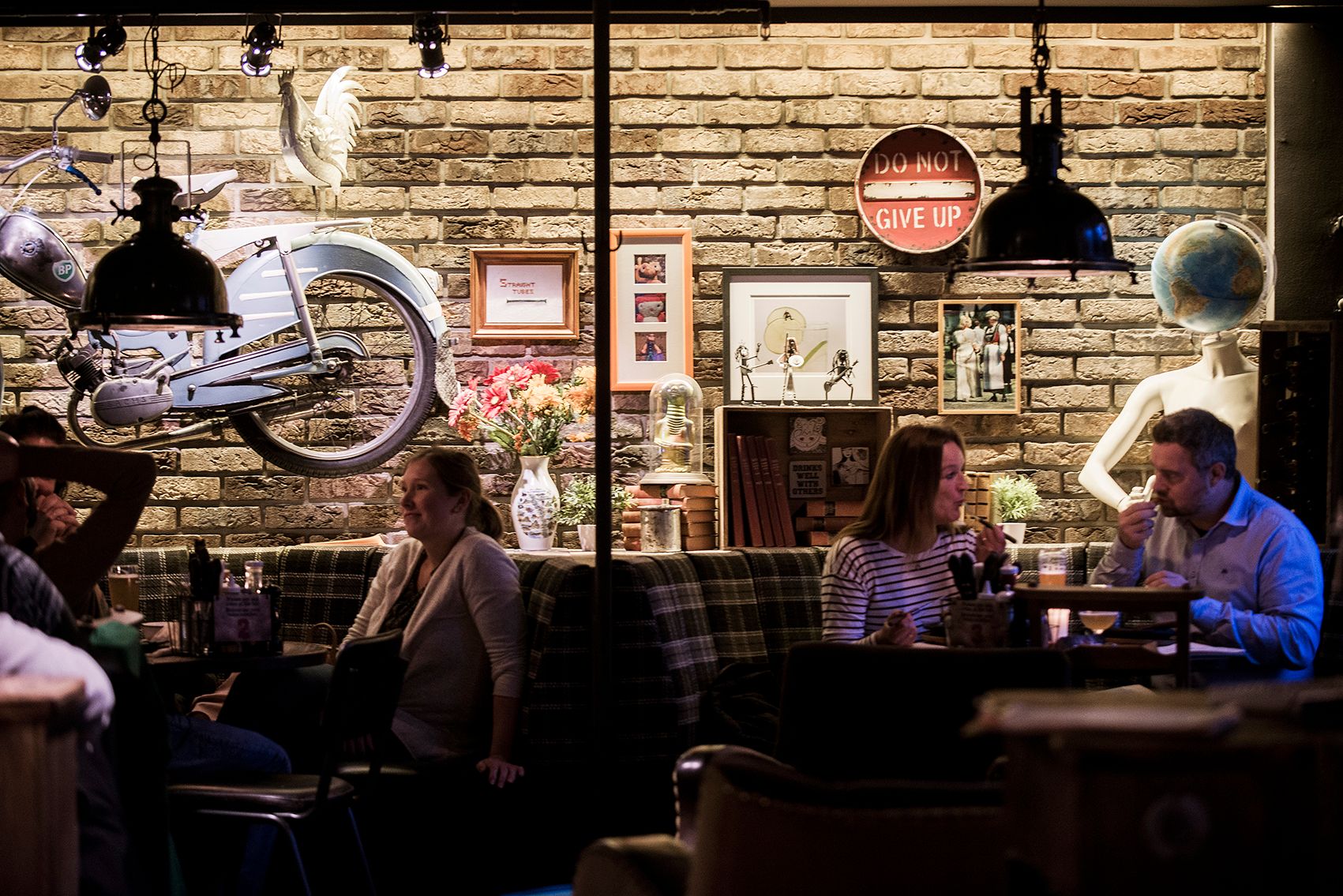 Guests enjoying dinner and drinks at Heim Gastropub
