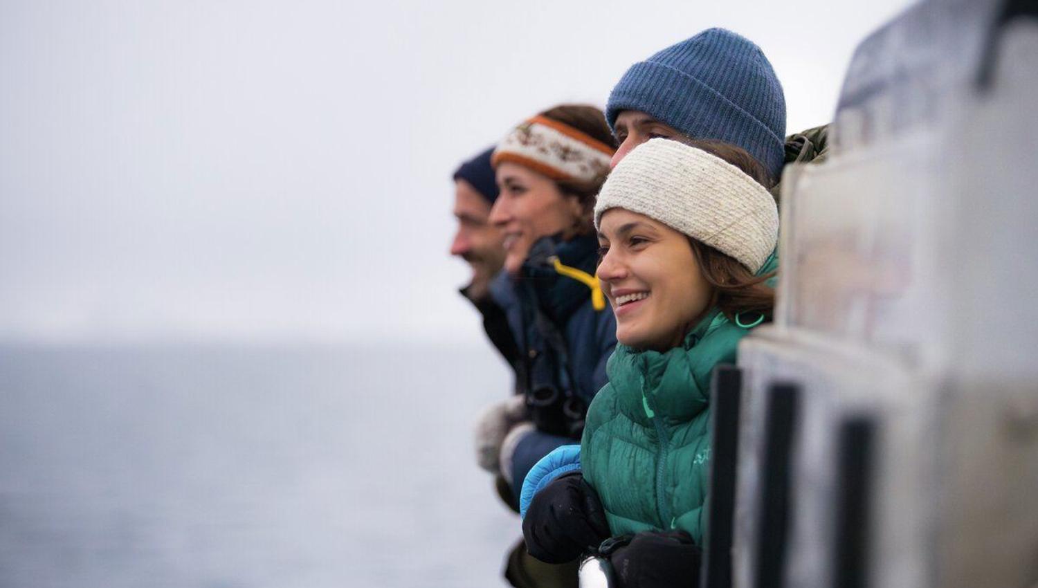 People enjoying the view on a whale watching tour with Rødne Fjord Cruise