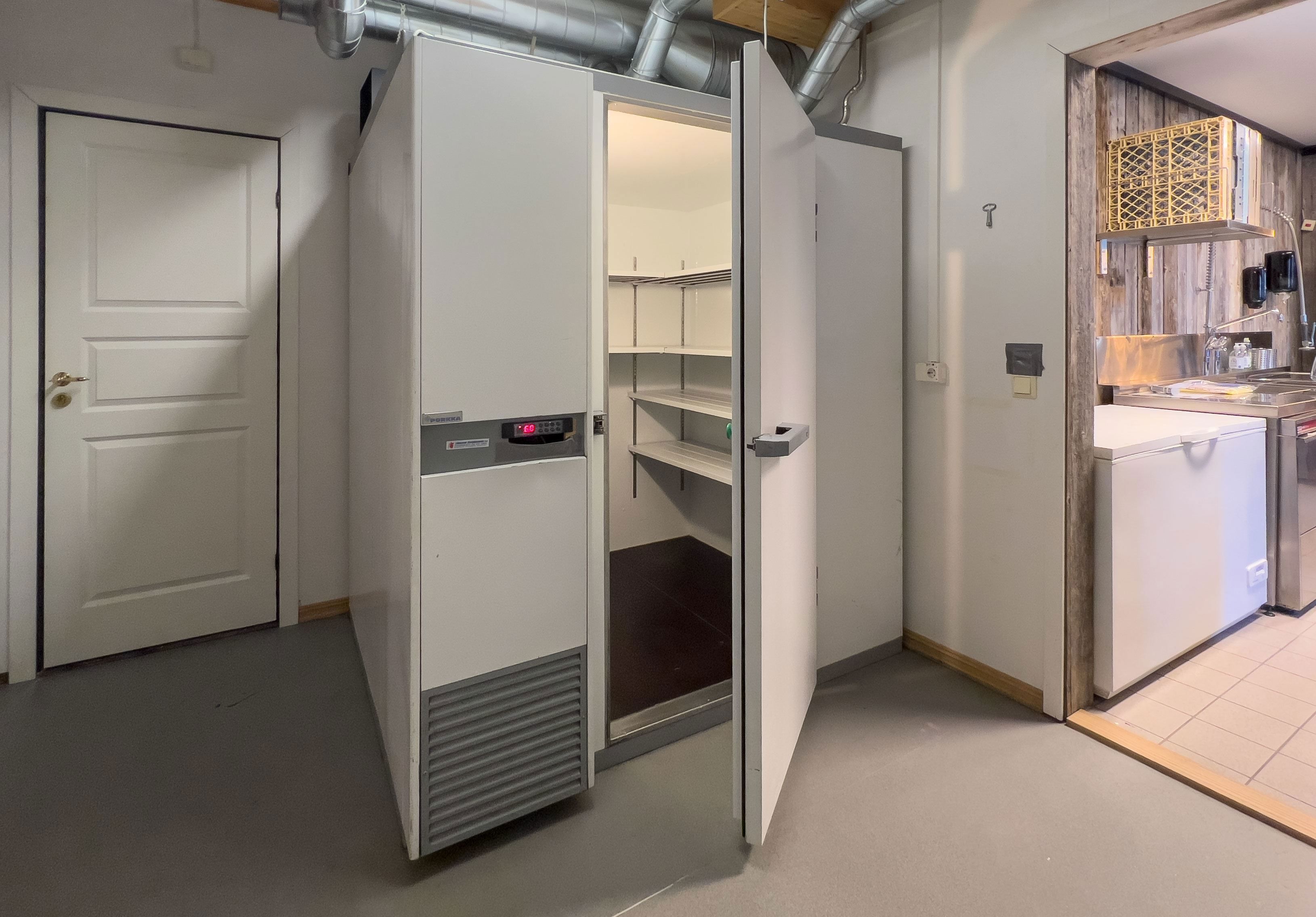 A white fridge with an open door.