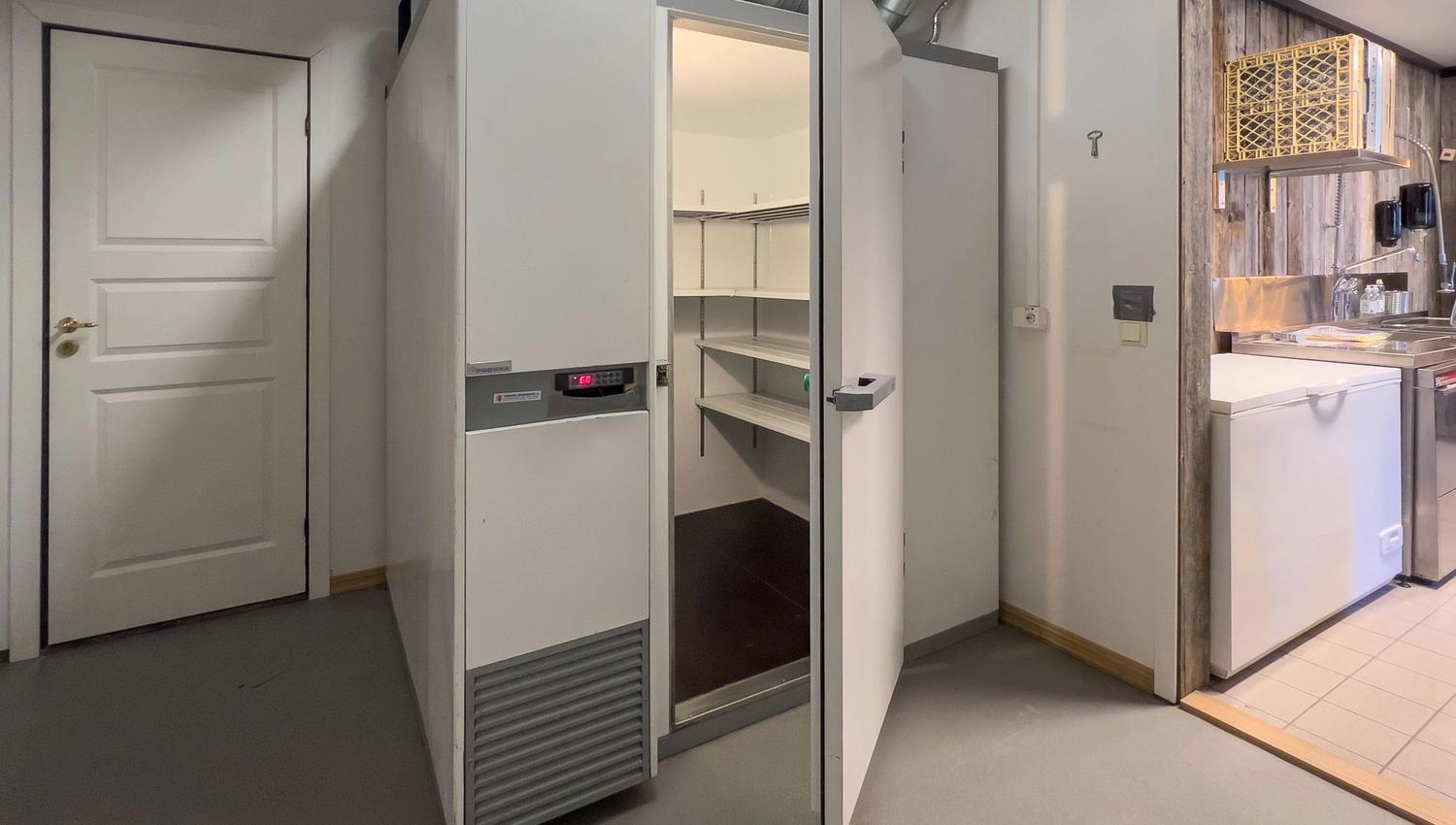 A white fridge with an open door.