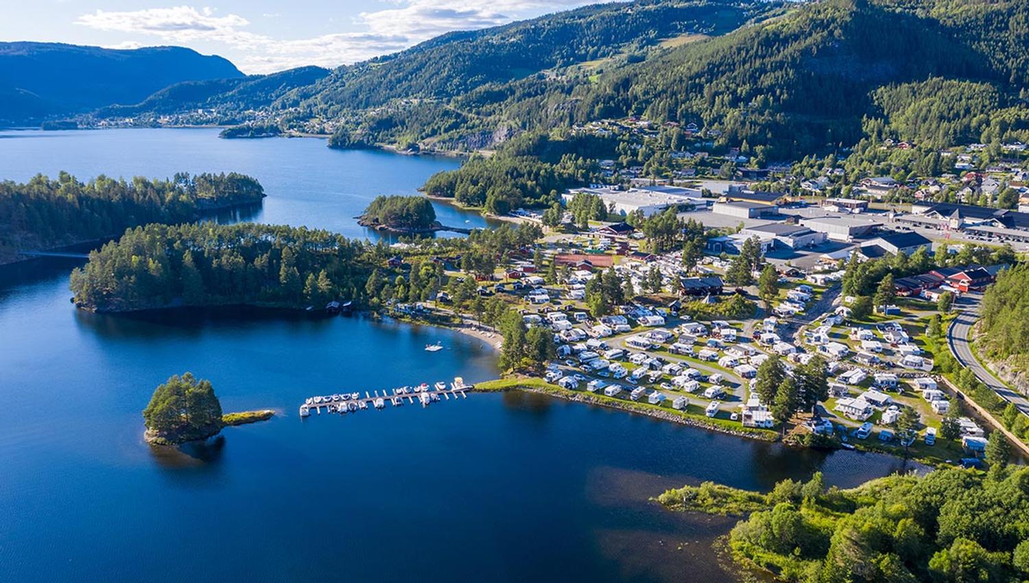 Aerial photo of a large campground on a lakeshore with beach and small islands